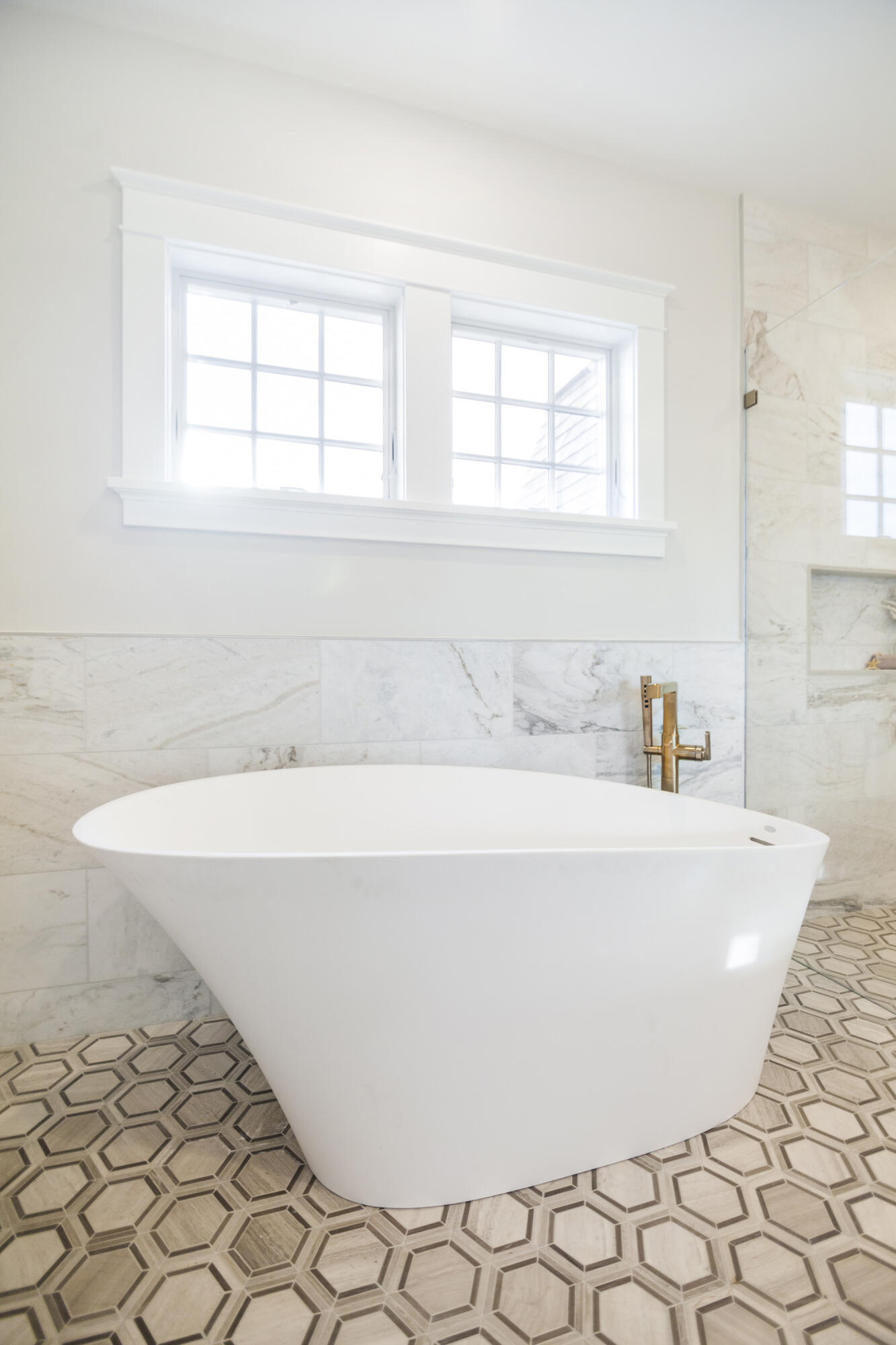 12 Coastline Drive Mashpee, MA 02649 - Photo 10 of 46 a bathroom with a bathtub and next to a window