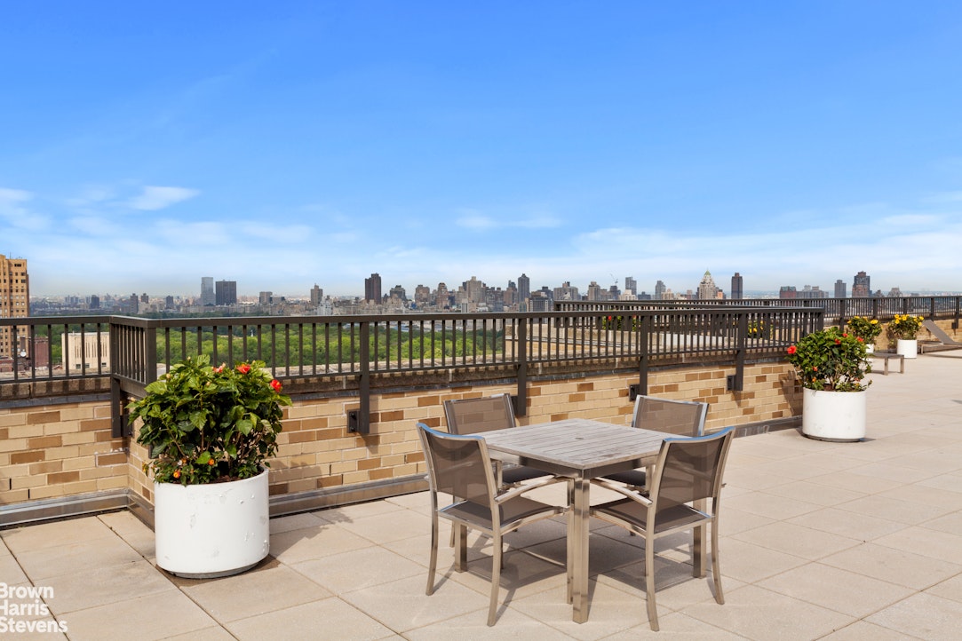 10 West 66th Street, Unit 23G Manhattan, NY 10023 - Photo 13 of 19 a view of a chairs and table on the terrace