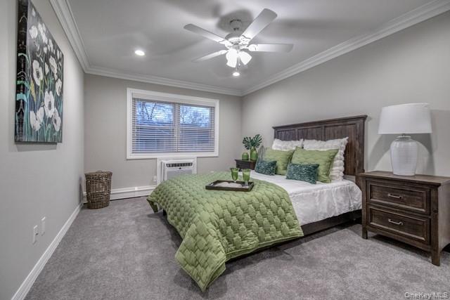 323 Terrace Road, Unit T08323 Bayport, NY 11705 - Photo 5 of 8 a bedroom with a bed and a chandelier