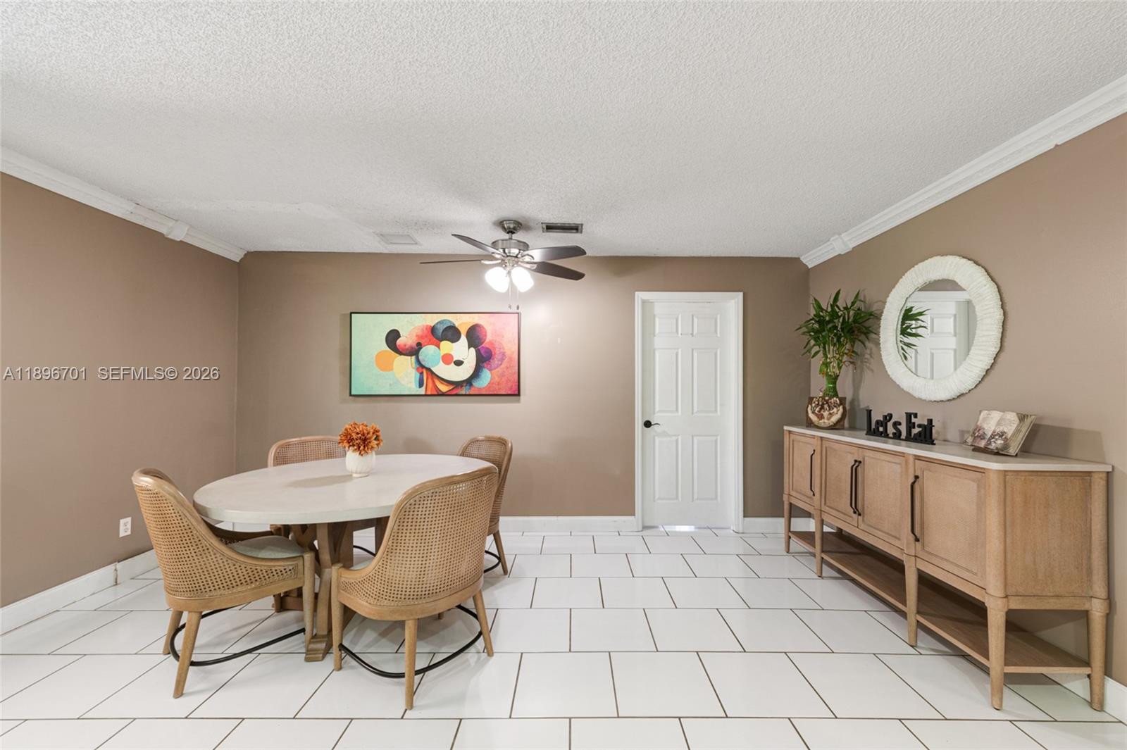 19491 Southwest 216th Street Miami, FL 33187 - Photo 15 of 32 a view of a dining room with furniture