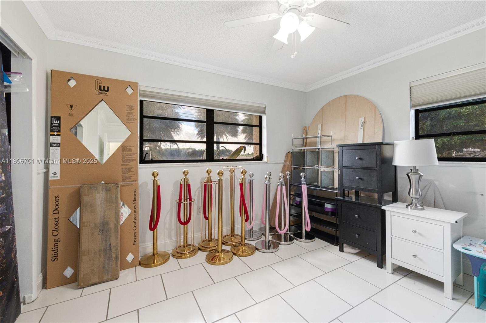19491 Southwest 216th Street Miami, FL 33187 - Photo 21 of 37 a view of a kitchen with fridge and workspace
