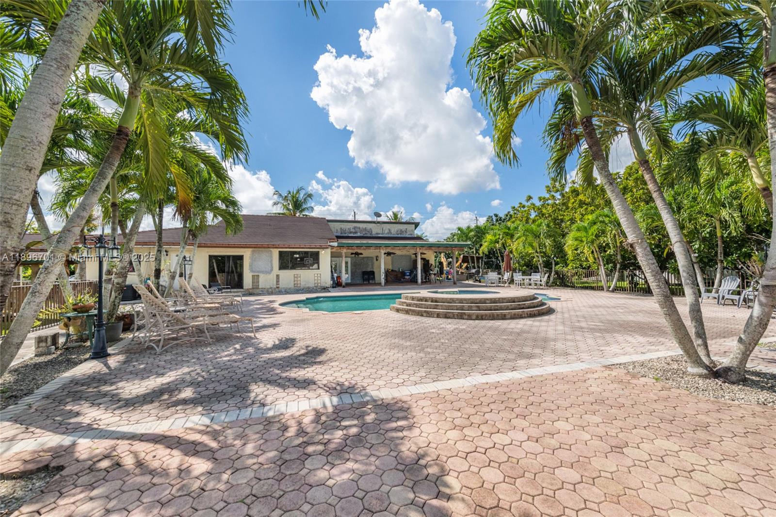 19491 Southwest 216th Street Miami, FL 33187 - Photo 33 of 37 a front view of a house with garden