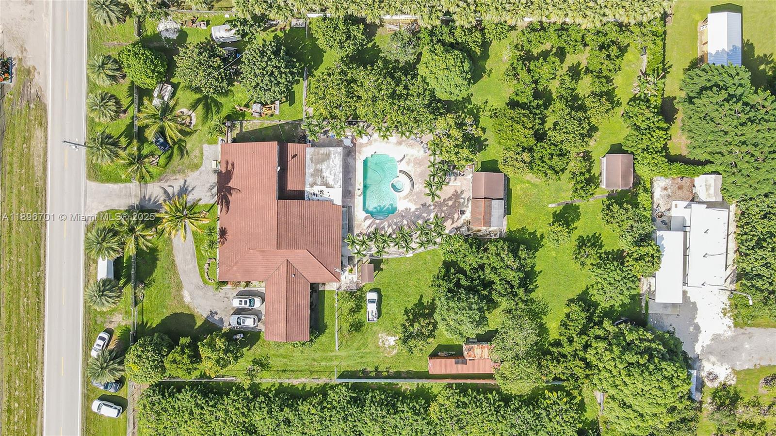 19491 Southwest 216th Street Miami, FL 33187 - Photo 36 of 37 an aerial view of a house with a yard and garden