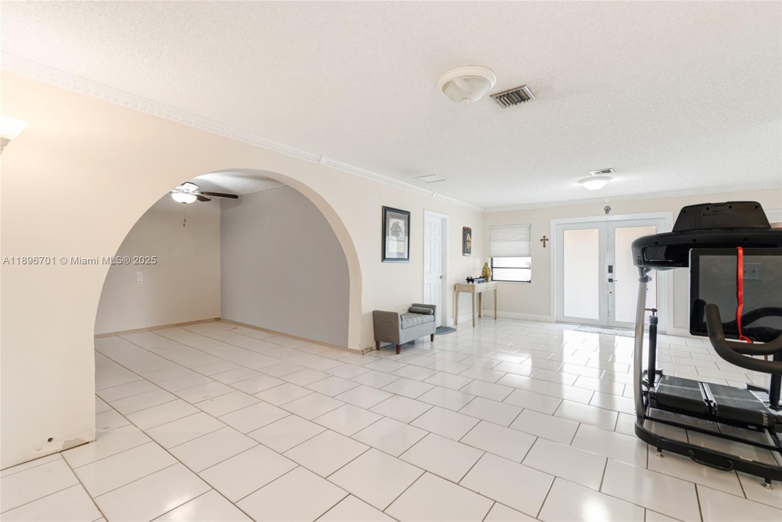19491 Southwest 216th Street Miami, FL 33187 - Photo 7 of 37 a view of a living room washer and dryer