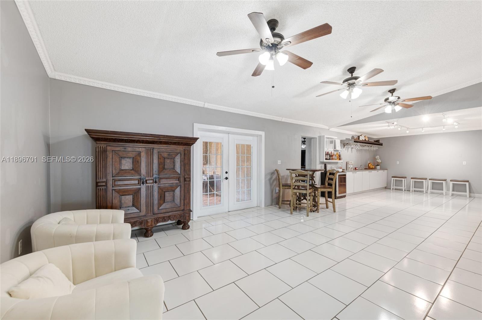 19491 Southwest 216th Street Miami, FL 33187 - Photo 8 of 32 a living room with furniture and natural light