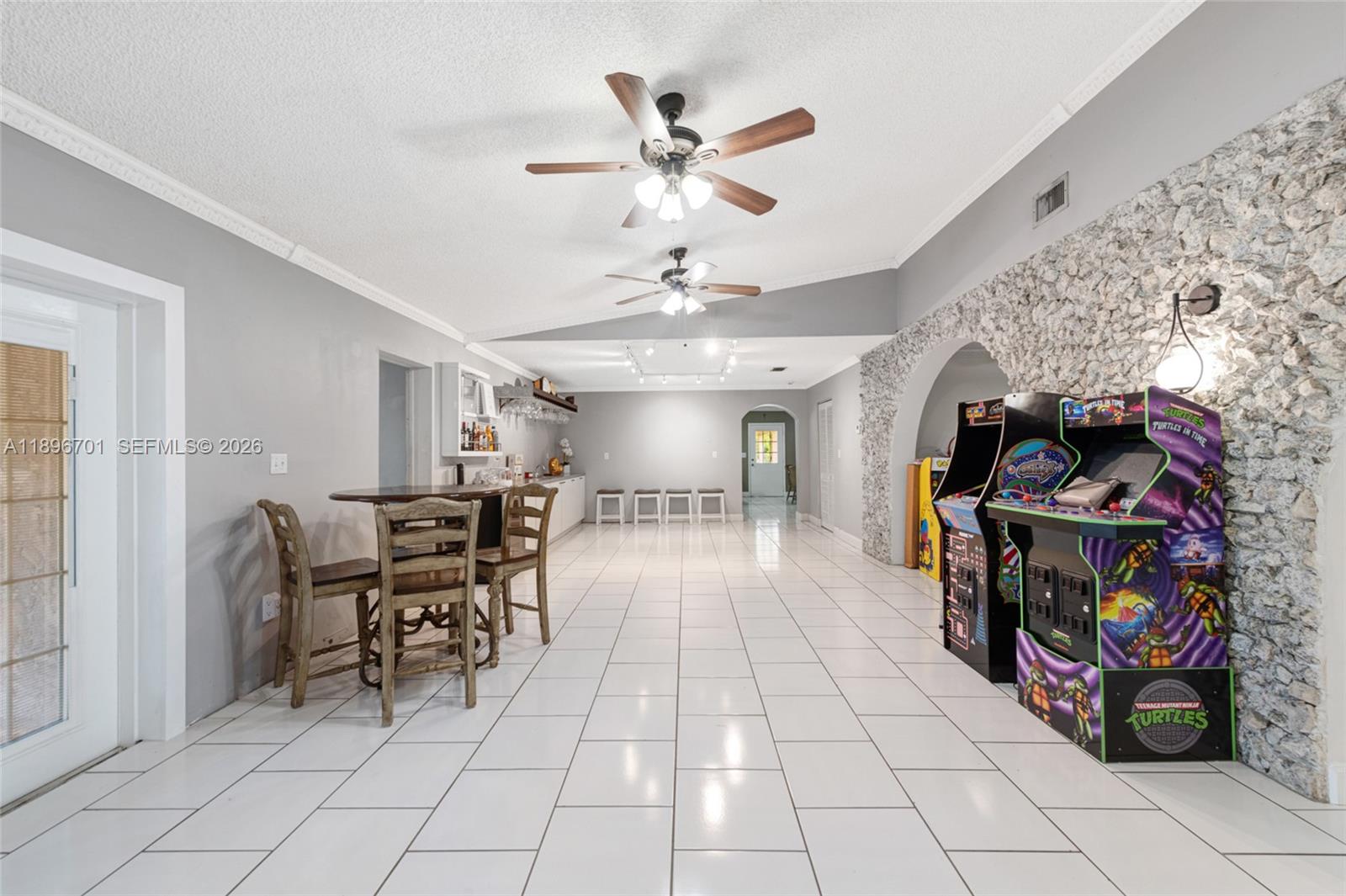 19491 Southwest 216th Street Miami, FL 33187 - Photo 9 of 32 a view of a livingroom with furniture and a ceiling fan