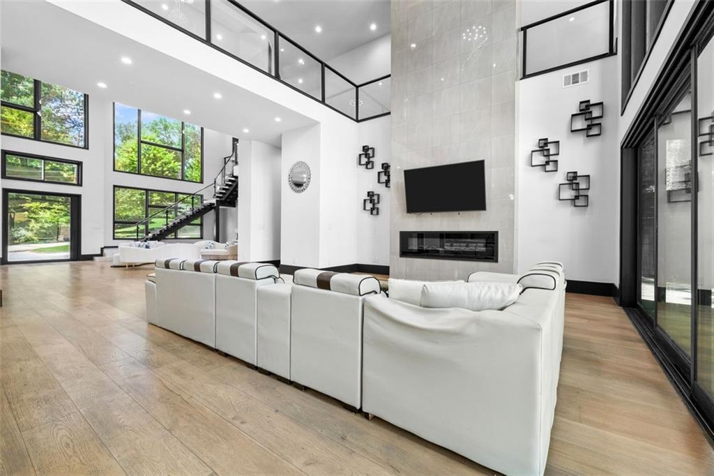 2401 Greenglade Road Northeast Atlanta, GA 30345 - Photo 13 of 64 a living room with furniture and a flat screen tv
