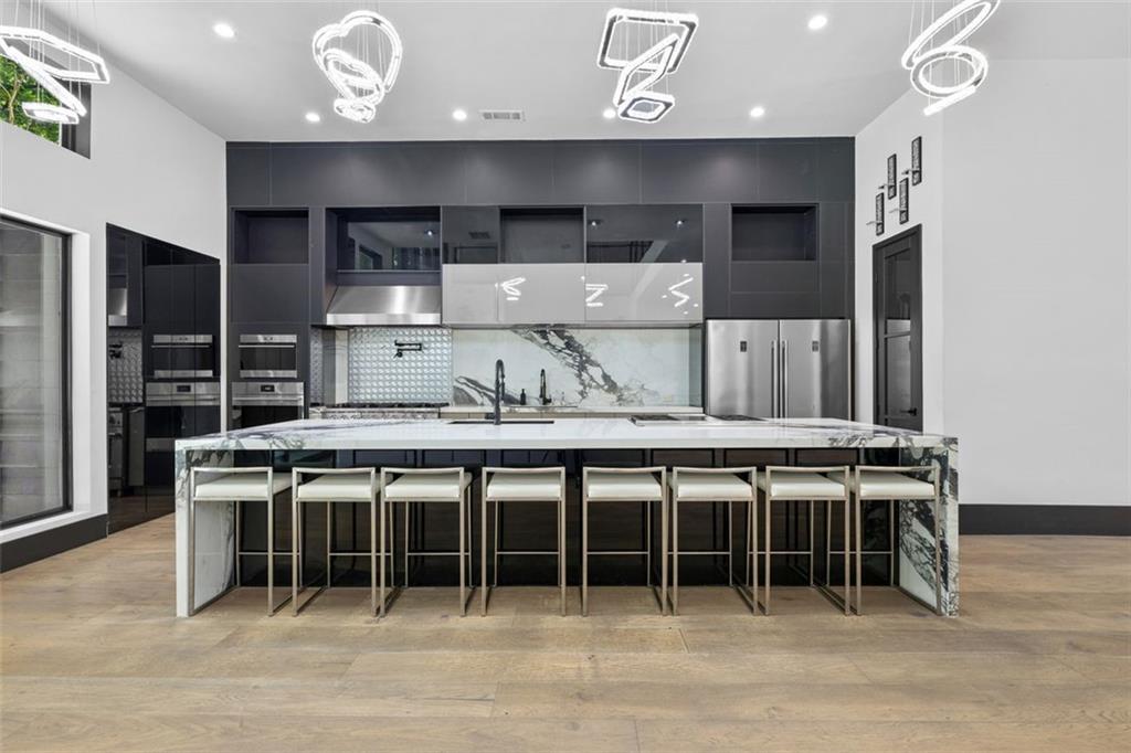2401 Greenglade Road Northeast Atlanta, GA 30345 - Photo 15 of 64 a kitchen with a table and chairs in it