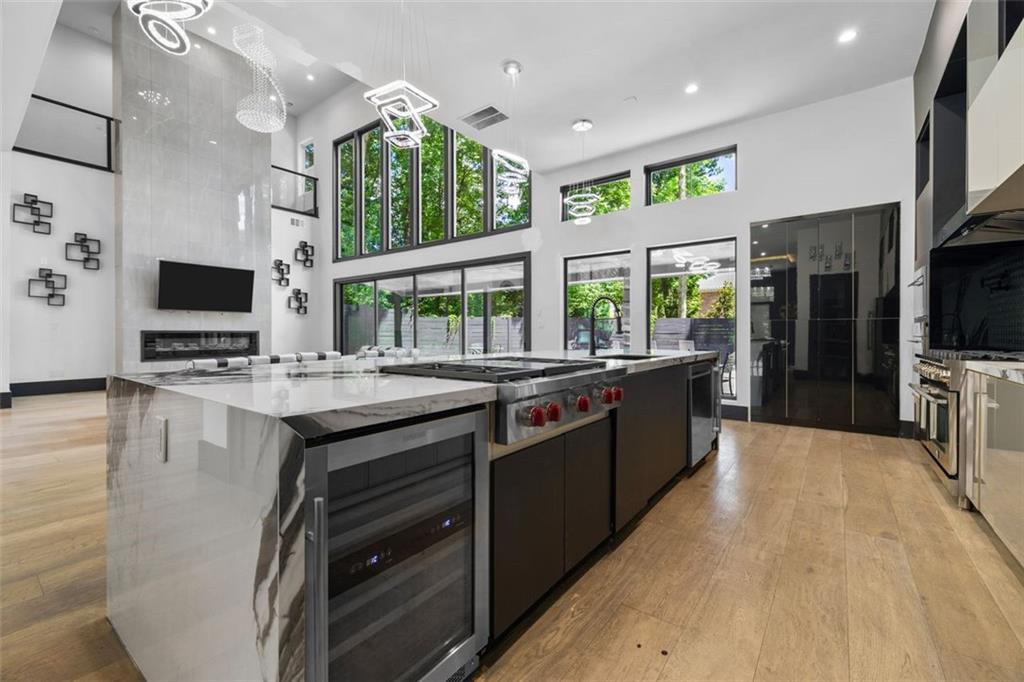 2401 Greenglade Road Northeast Atlanta, GA 30345 - Photo 19 of 64 a large kitchen with kitchen island granite countertop a large counter top stainless steel appliances and cabinets