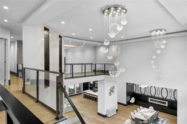 a bedroom with two beds and painting on the wall