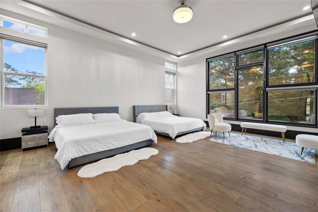 2401 Greenglade Road Northeast Atlanta, GA 30345 - Photo 22 of 64 a spacious bedroom with a bed and large window