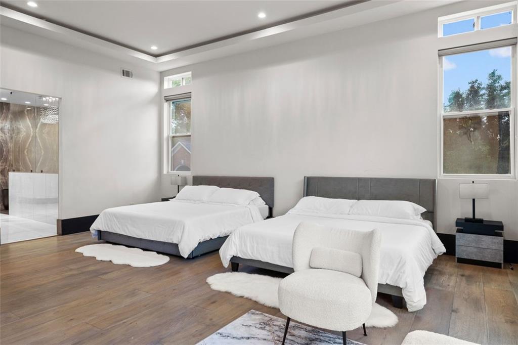 2401 Greenglade Road Northeast Atlanta, GA 30345 - Photo 25 of 64 a bedroom with two beds and painting on the wall