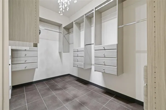a spacious bathroom with a double vanity sink mirror and shower