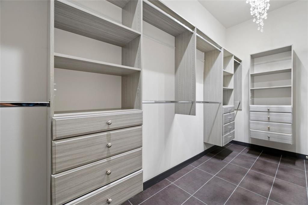 2401 Greenglade Road Northeast Atlanta, GA 30345 - Photo 31 of 64 a view of walk in closet with empty racks