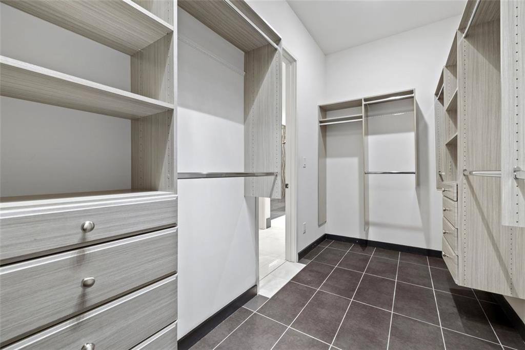 2401 Greenglade Road Northeast Atlanta, GA 30345 - Photo 32 of 64 a view of walk in closet with empty racks