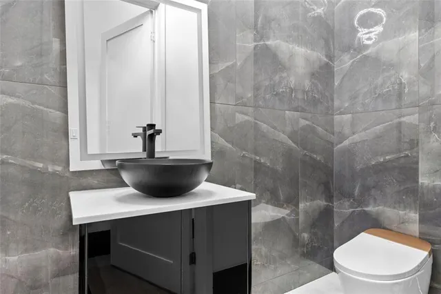 a spacious bedroom with a bed and large windows