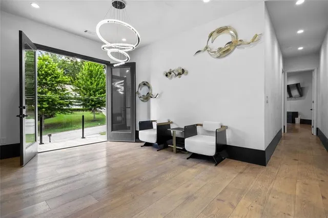 a bathroom with a sink a mirror a vanity and a shower