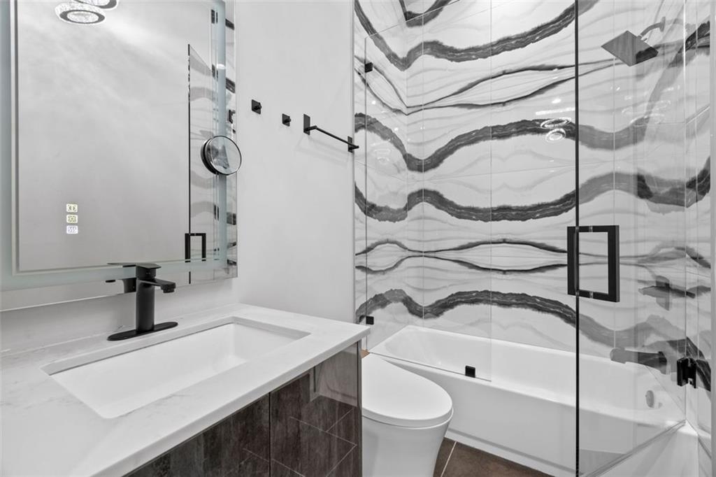 2401 Greenglade Road Northeast Atlanta, GA 30345 - Photo 41 of 64 a bathroom with a sink toilet and shower