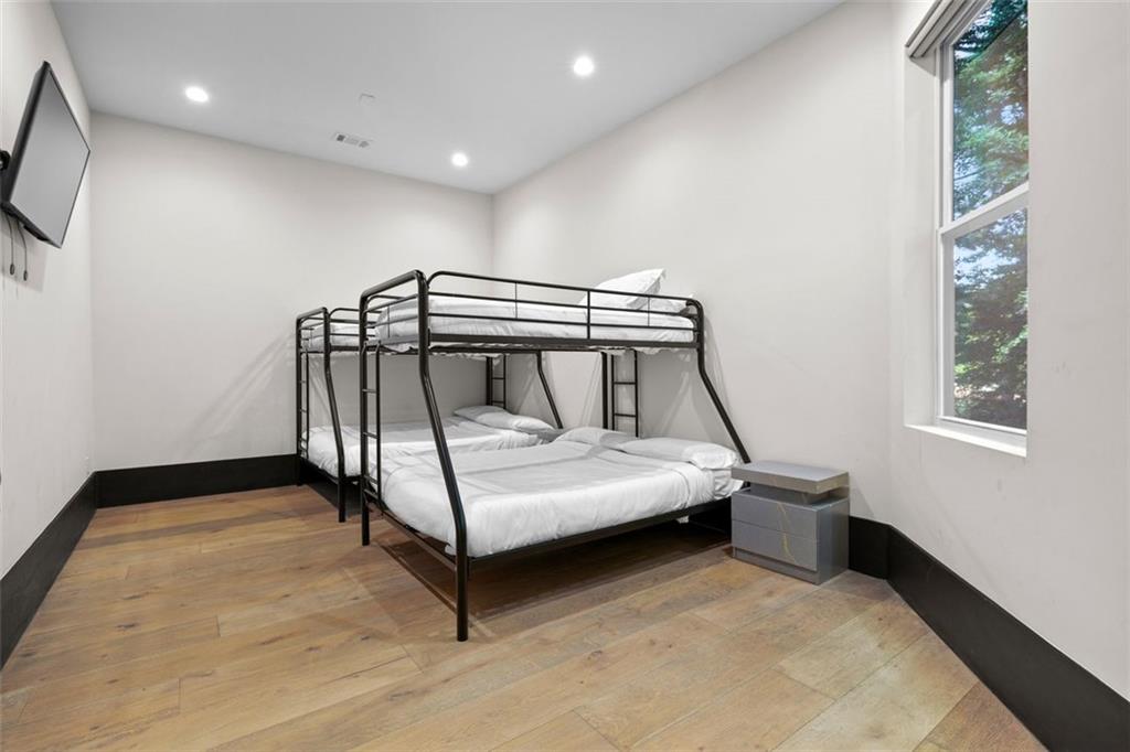 2401 Greenglade Road Northeast Atlanta, GA 30345 - Photo 50 of 64 a bedroom with a bed and a window