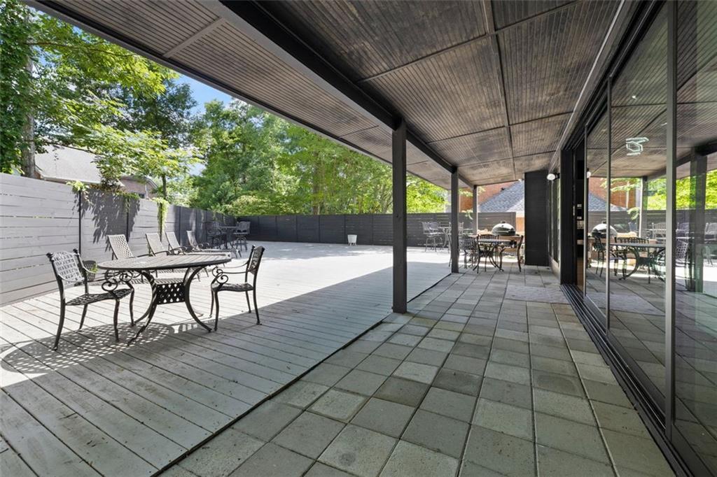 2401 Greenglade Road Northeast Atlanta, GA 30345 - Photo 51 of 64 a view of a patio with a table and chairs