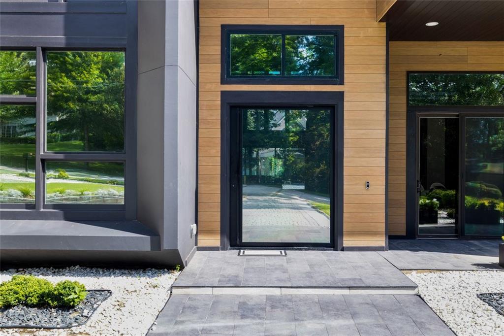 2401 Greenglade Road Northeast Atlanta, GA 30345 - Photo 60 of 64 a living room with a large window and a fireplace