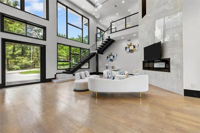 a living room with furniture and a large window