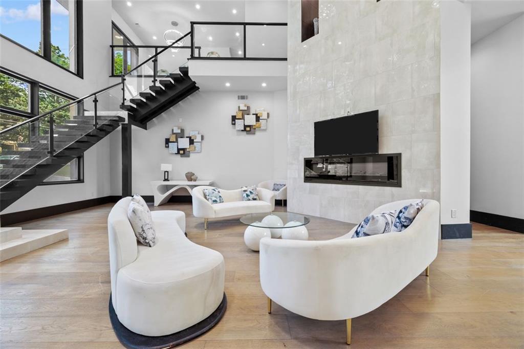 2401 Greenglade Road Northeast Atlanta, GA 30345 - Photo 9 of 64 a living room with furniture and a flat screen tv