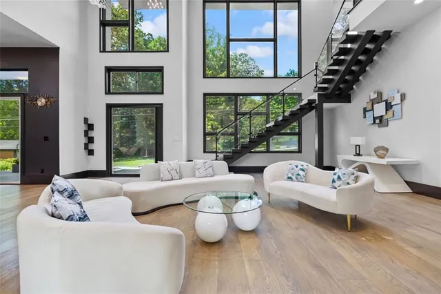 a living room with furniture and a large window