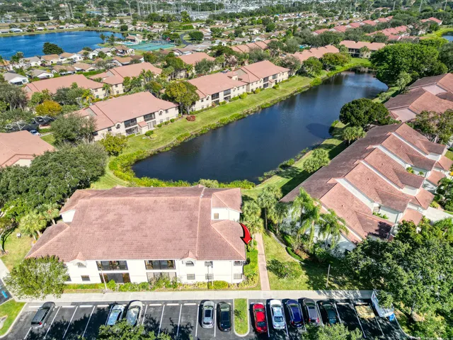 an aerial view of multiple houses with yard