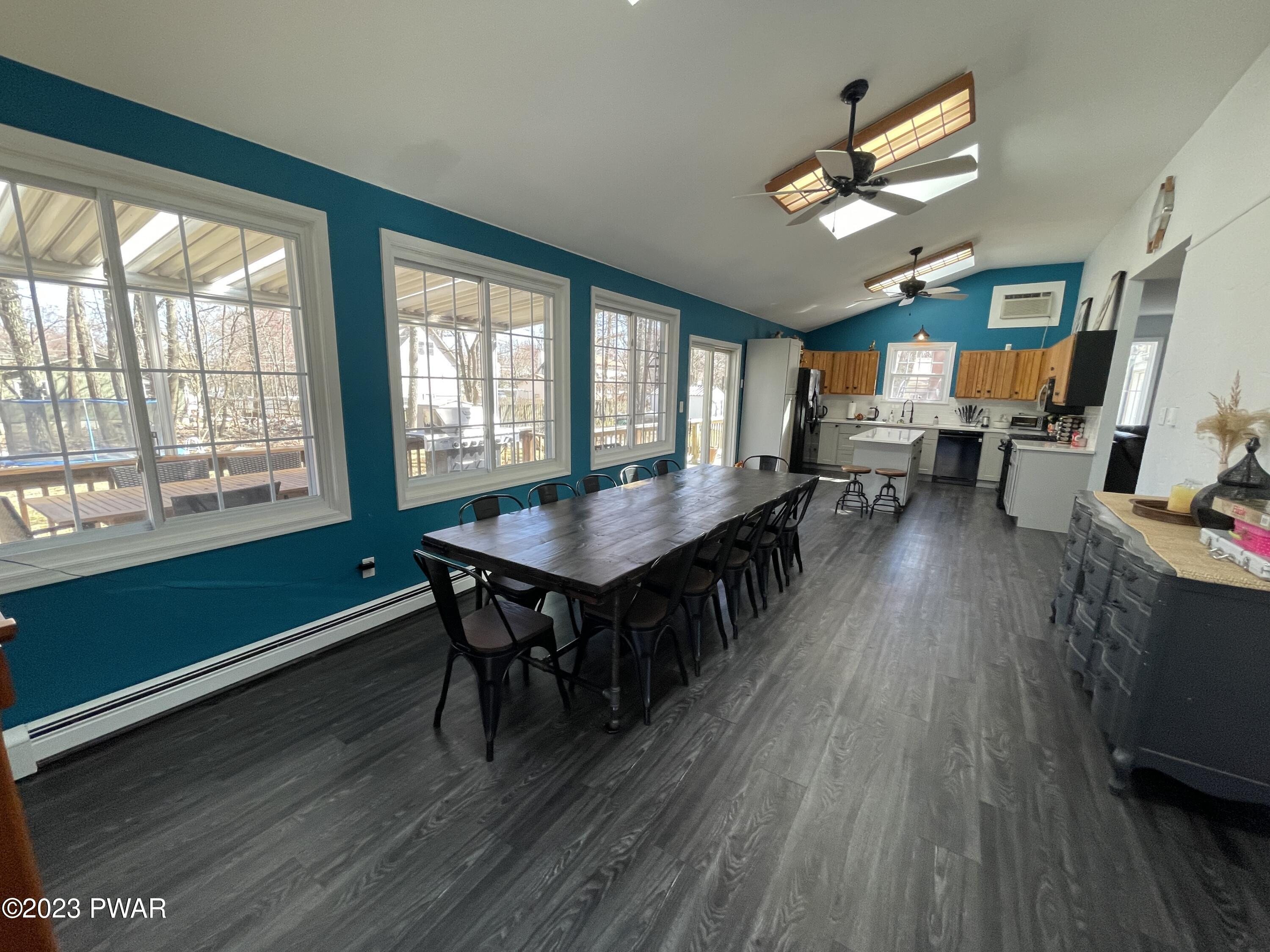146 Roundhill Road Dingmans Ferry, PA 18328 - Photo 19 of 53 a living room with furniture wooden floor and a window