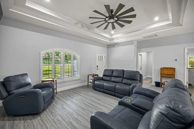 a living room with furniture and a window