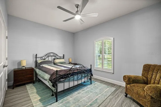 a bedroom with a bed and a couch