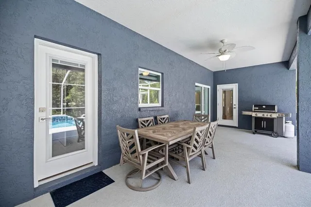 a dining room with furniture and window