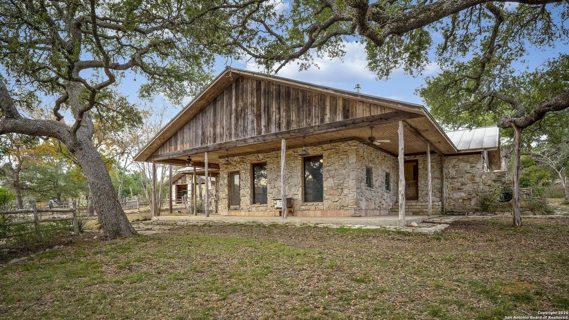 360 Kirk Lane Bulverde, TX 78163 - Photo 2 of 50 a view of a house with large trees