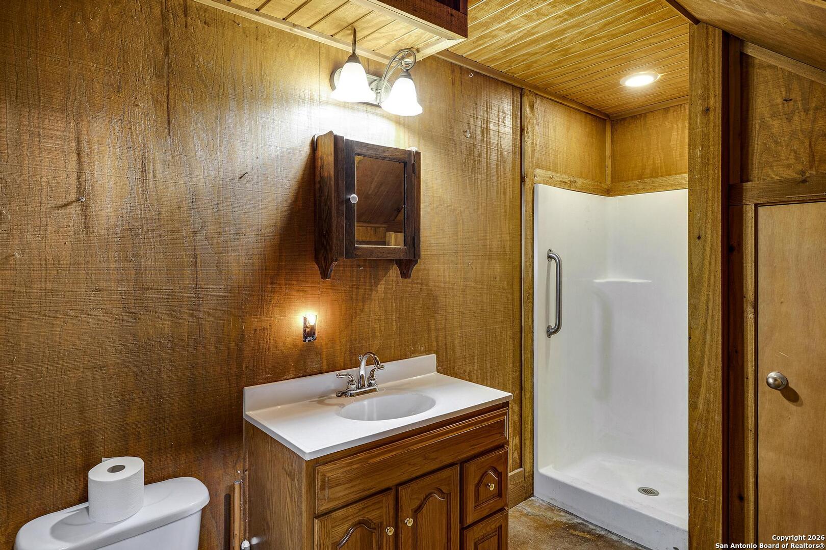 360 Kirk Lane Bulverde, TX 78163 - Photo 25 of 50 a bathroom with a sink a toilet and shower