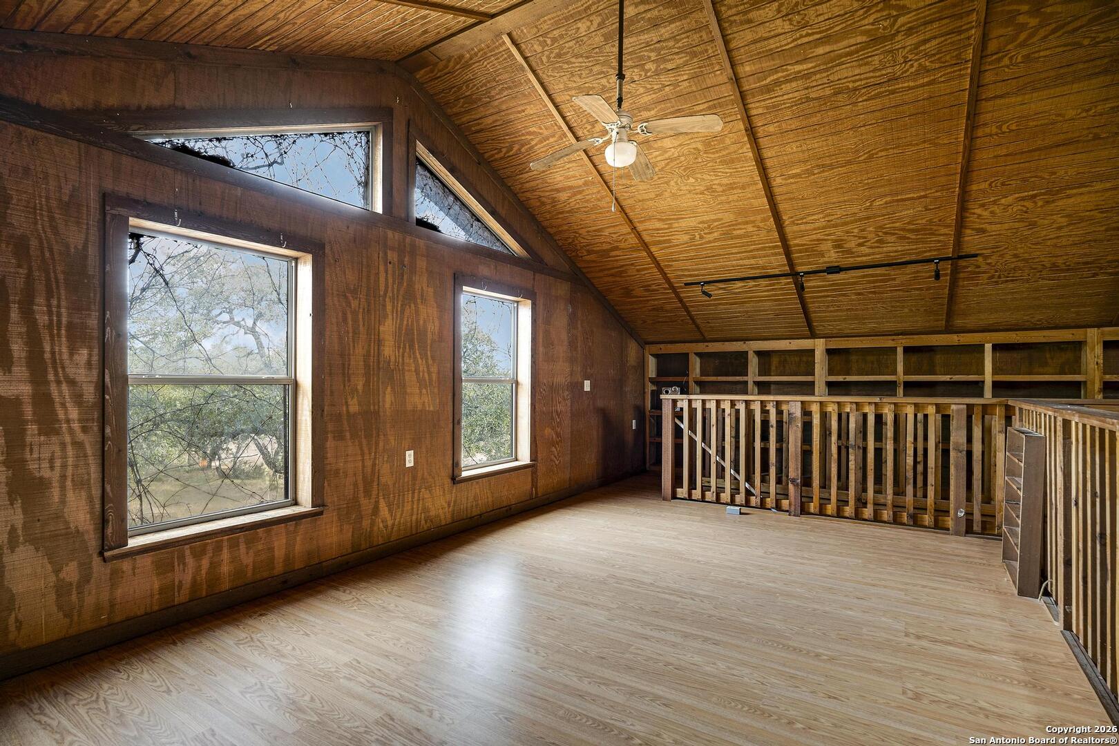 360 Kirk Lane Bulverde, TX 78163 - Photo 26 of 50 a view of a room with wooden floor and windows