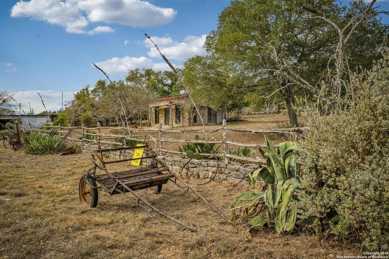 360 Kirk Lane Bulverde, TX 78163 - Photo 30 of 50 a view of a chairs and table in a backyard