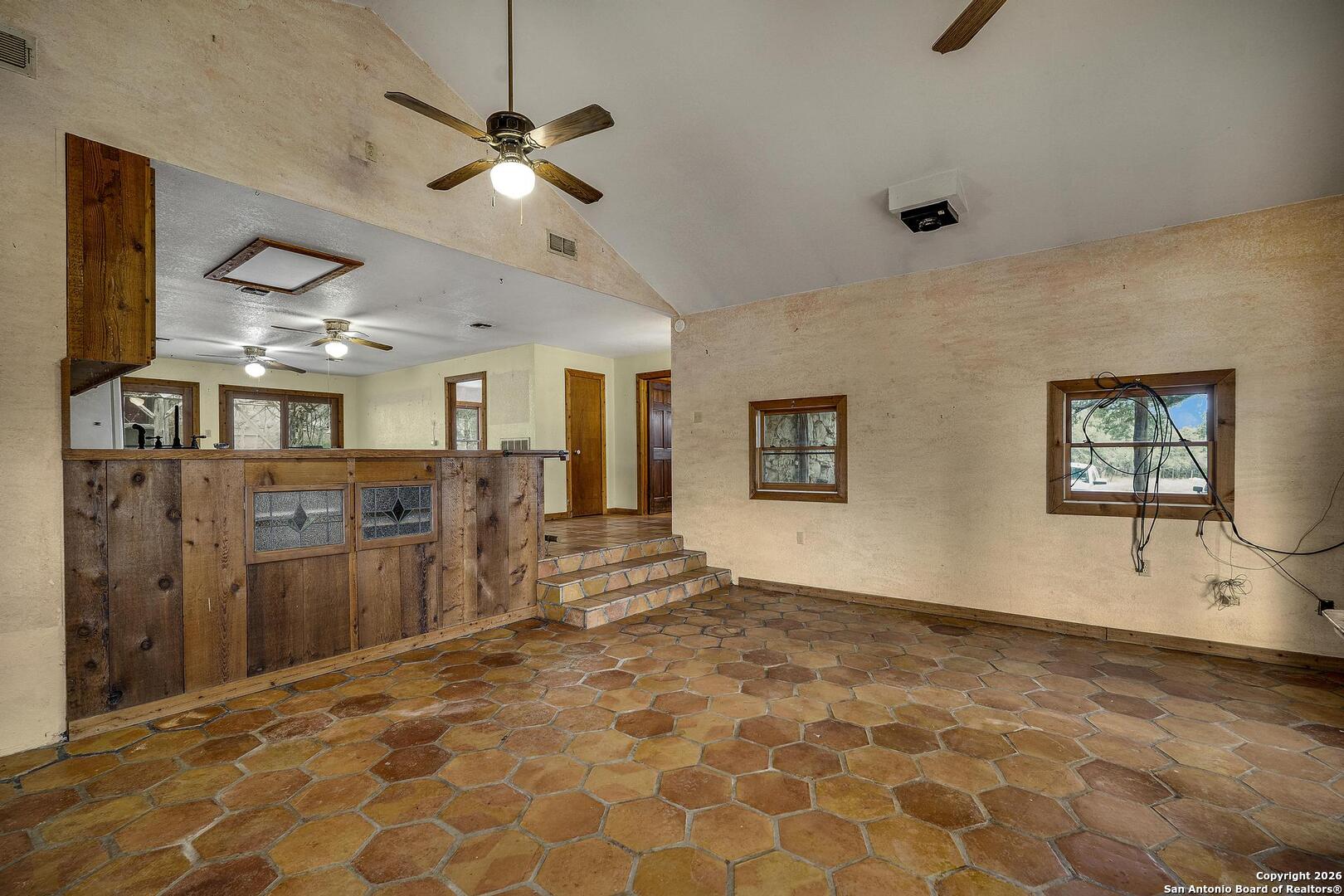 360 Kirk Lane Bulverde, TX 78163 - Photo 3 of 50 a view of a livingroom with a furniture ceiling fan and window