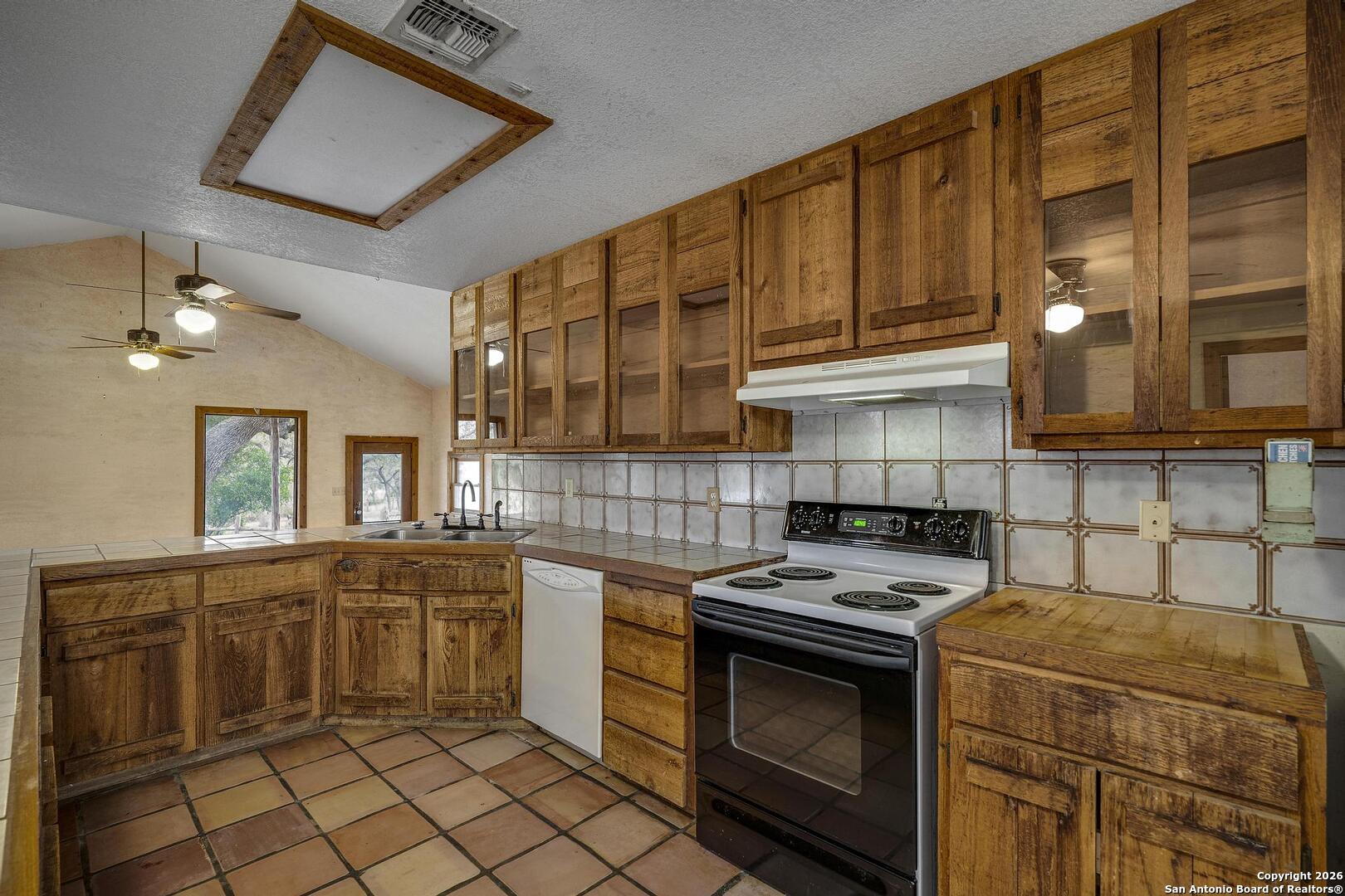 360 Kirk Lane Bulverde, TX 78163 - Photo 5 of 50 a kitchen with a stove and a sink
