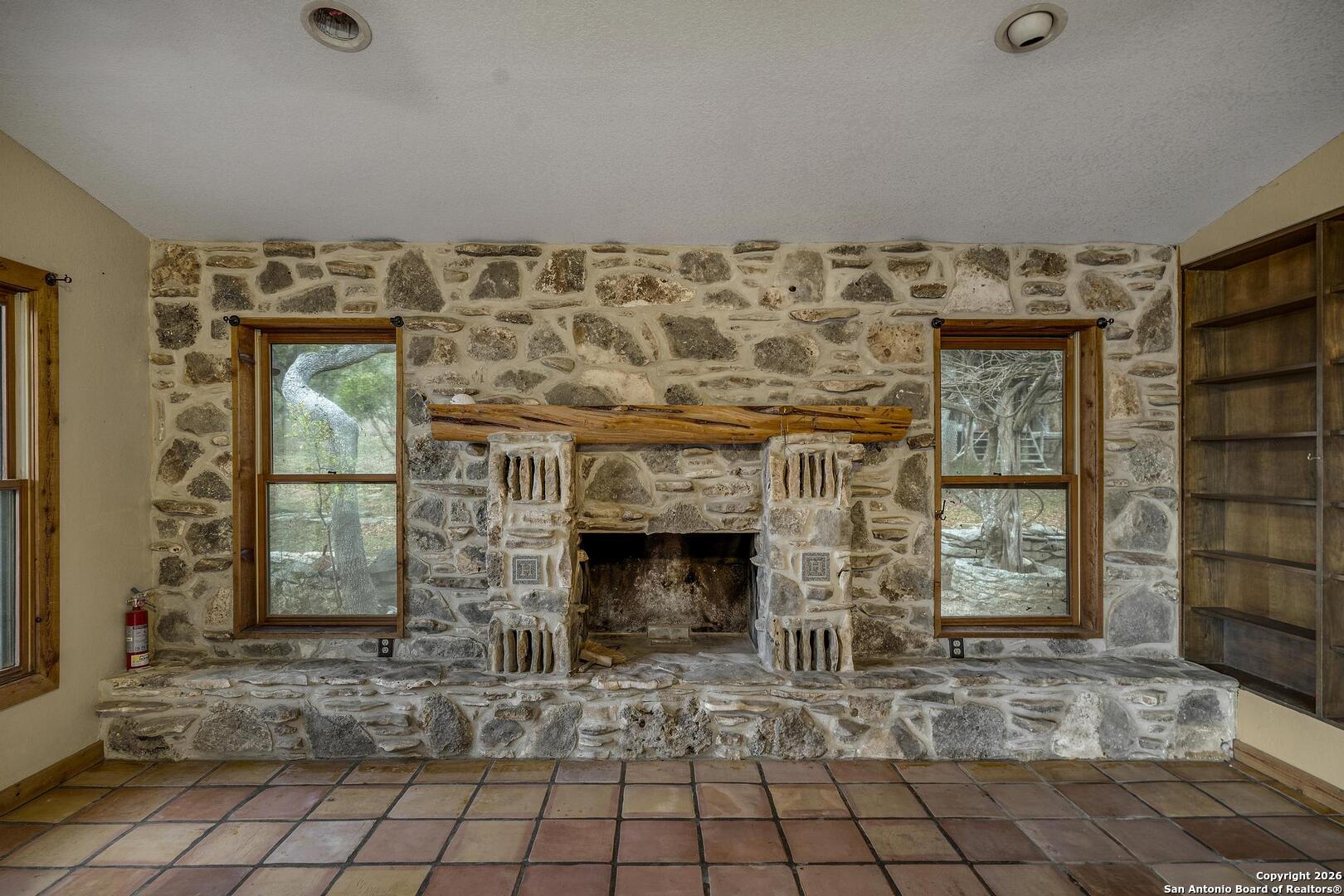 360 Kirk Lane Bulverde, TX 78163 - Photo 8 of 50 a living room with a fireplace