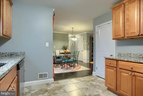 a large bathroom with a granite countertop sink a mirror and a shower
