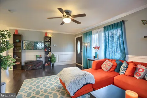 a bedroom with furniture and wooden floor