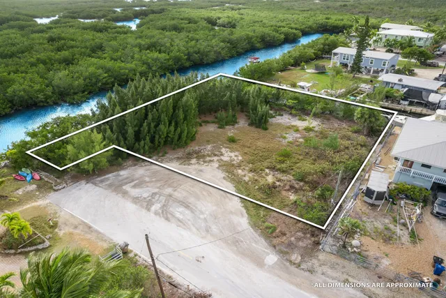 a view of a pool yard and outdoor seating