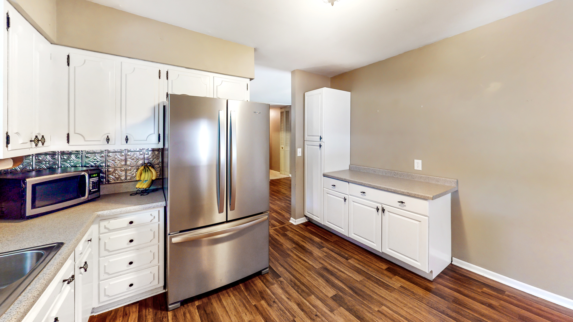 44 Aldon Road Montgomery, IL 60538 - Photo 8 of 24 a kitchen with stainless steel appliances a refrigerator a stove and white cabinets