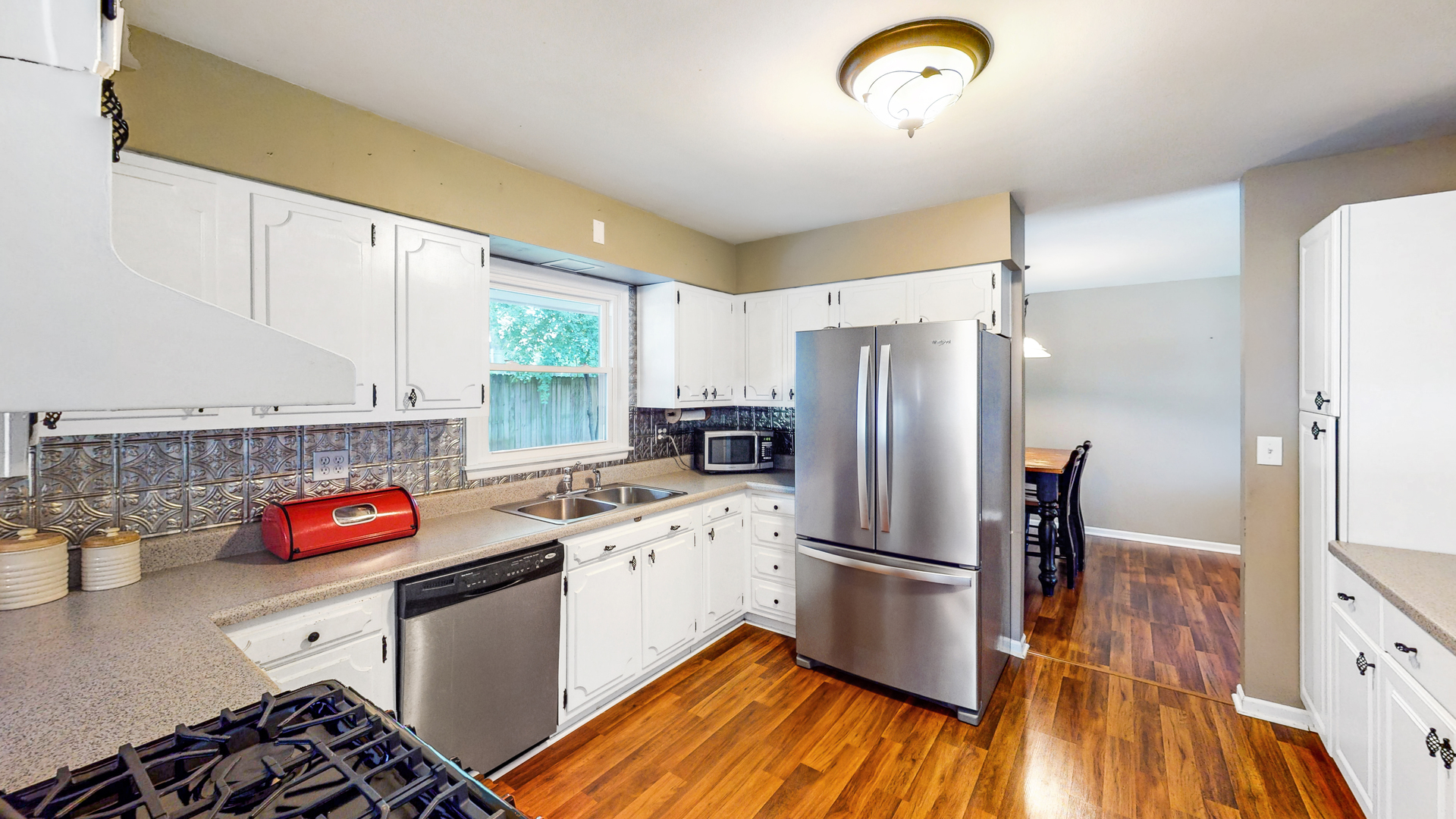 44 Aldon Road Montgomery, IL 60538 - Photo 9 of 24 a kitchen with a refrigerator and a stove top oven