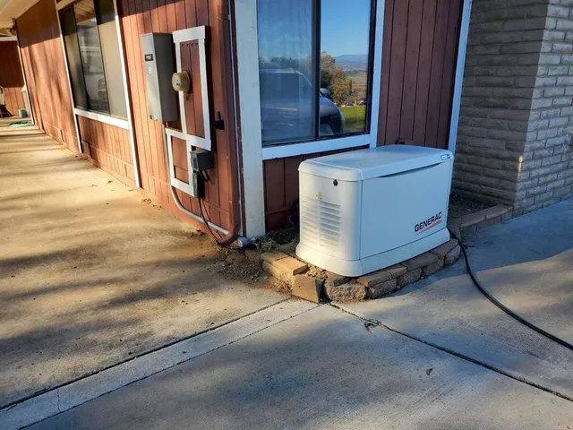 a view of a backyard with plants and outdoor seating