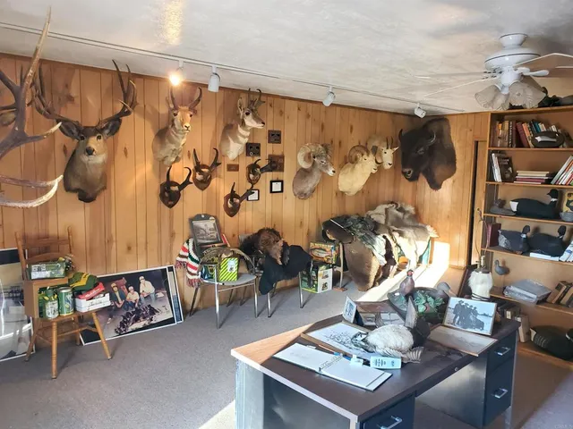 a view of pool with outdoor seating and house in the background
