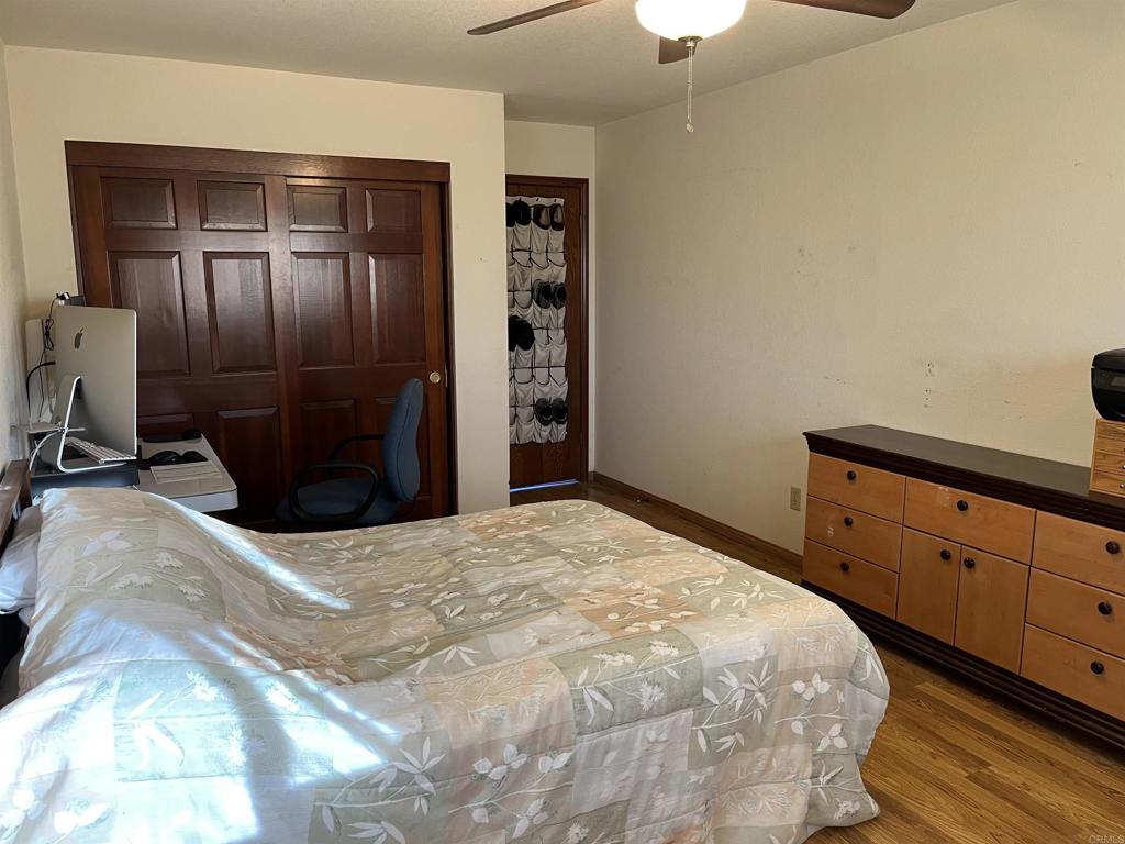 17910 Bluegrass Road Ramona, CA 92065 - Photo 29 of 33 a bedroom with a bed and a dresser