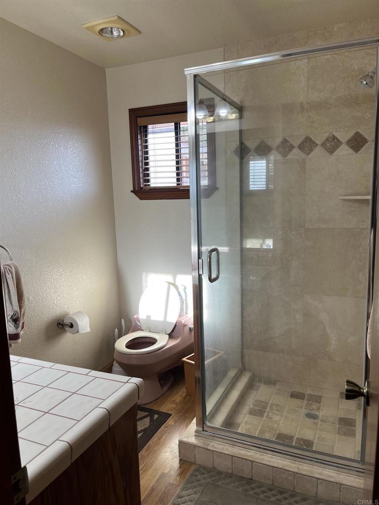 17910 Bluegrass Road Ramona, CA 92065 - Photo 33 of 33 a bathroom with a sink a toilet and shower