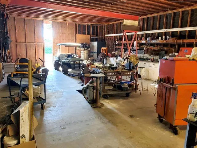 a view of a chairs and table in a patio